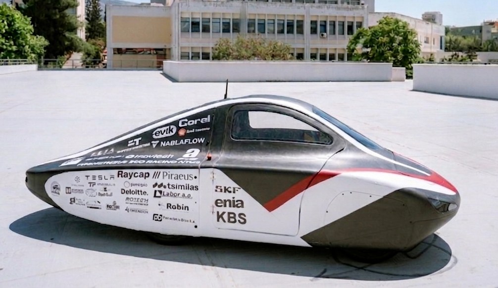 PYRFOROS IV in full side profile with team livery and sponsor branding, photographed at a static reveal